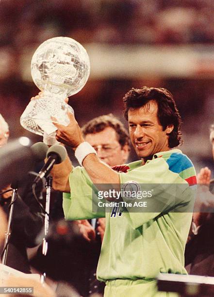 Imran Khan holds aloft the World Cup trophy after Pakistan's 22-run win against England in the Cricket World Cup final at the MCG, 25 March 1992. Neg...