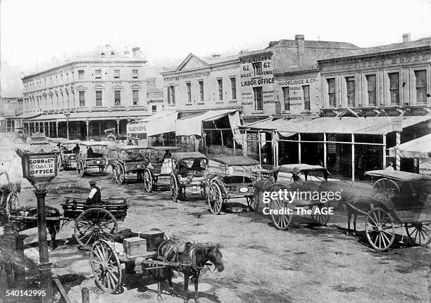 Bourke Street, looking towards Swanston Street, showing a sign for Cobb & Co Coach Office and horsedrawn cabs, Melbourne, 1862. THE AGE ARCHIVES