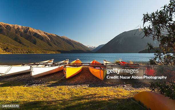 kayaks at lake rotoiti - nelson lakes national park stock pictures, royalty-free photos & images