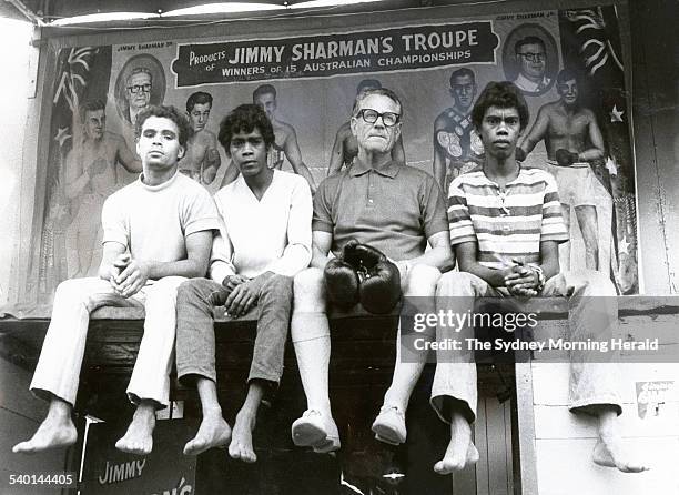 Jimmy Sharman with three members of the Jimmy Sharman Boxing Troupe: Gerry Hobbley from Milanda, Queensland, and Wally and Max Snider from Kuranda...