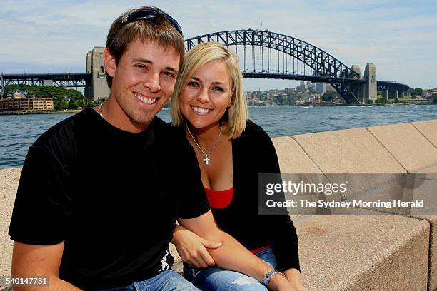 Australian golfer Aaron Baddeley and his wife Richelle pose in front of the Sydney Harbour Bridge, 12 November 2006. SMH Picture by TIM CLAYTON