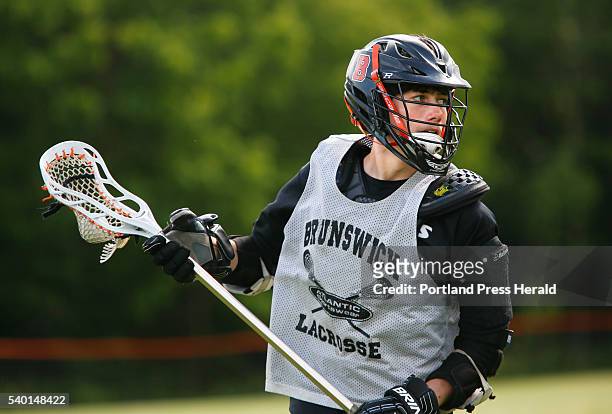Jameson Cyr handles the ball during a Brunswick boys lacrosse practice.