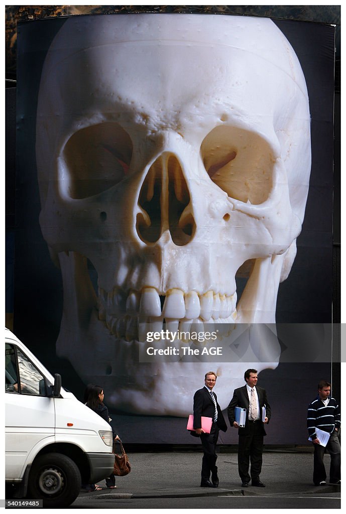 A large print of a skull adorns the front of the Republic Building corner of Que