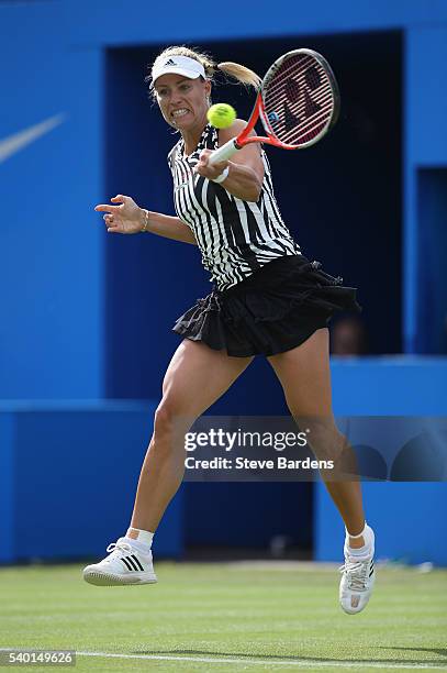 Angelique Kerber of Germany plays a forehand during her women's singles first round match against Shuai Peng of China on day two of the WTA Aegon...