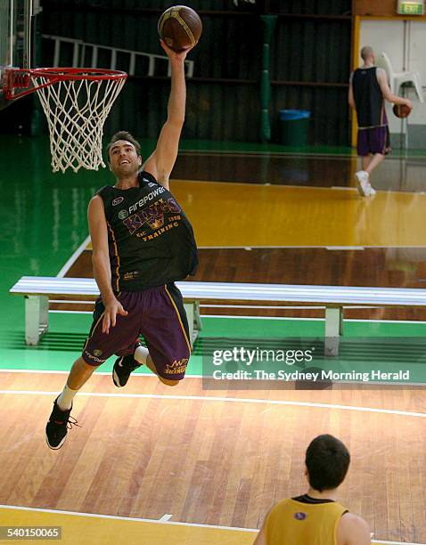 The Kings' Jason Smith slams dunks during a Sydney Kings training session at Alexandria, 19 February 2007. SMH Picture by CRAIG GOLDING