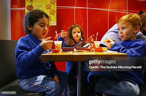 McDonald's Pasta Zoo menu launch. Jamie left, Isabella centre and Mark right, try out the new pasta zoo menu now avilable for children at McDonalds...