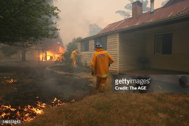 Victorian Bushfires. Fire crews rush to save a house from an approaching bushfire at Tolmie, 22 kilometres from Mansfield in Victoria, 16 January...