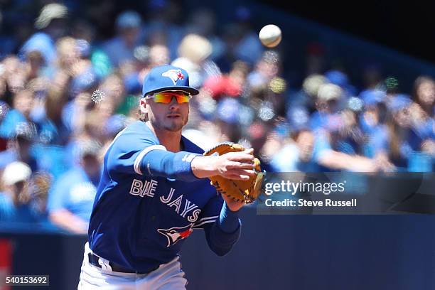 Toronto Blue Jays third baseman Josh Donaldson throws out a runner as the Toronto Blue Jays play an afternoon game against the Philadelphia Phillies...