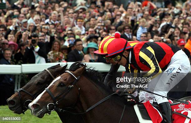 Spring Racing Carnival 2006. Jockey Yasunari Iwata rides Delta Blues, right, wins the 2006 Melbourne Cup in photo finish from Damien Oliver on Pop...