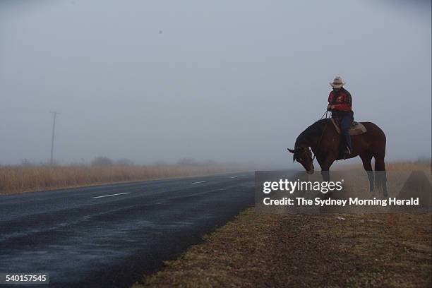 Janelle Little poses for a photo in the early morning fog on the Gwydir Highway 40km from Moree, NSW, 7 July 2006. SMH Picture by ANDREW MEARES