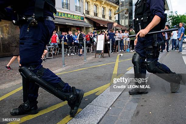 French riot police arrive following an altercation between Russia and England football fans in the city of Lille on June 14 three days after they...