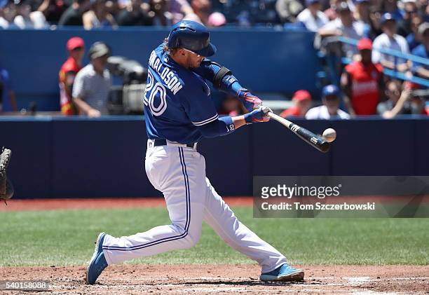 Josh Donaldson of the Toronto Blue Jays hits a grand slam home run in the third inning during MLB game action against the Philadelphia Phillies on...