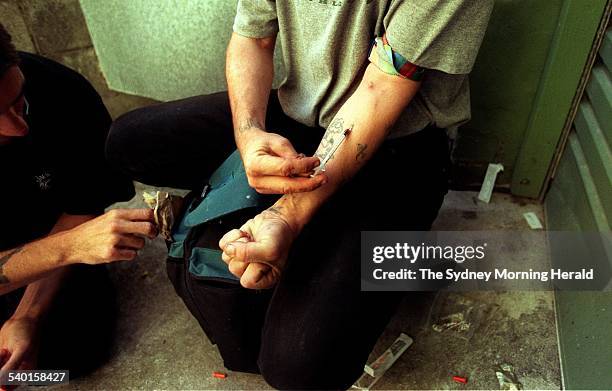 Drug users shoot up in a lane way at Kings Cross, instead of using the injecting room in a nearby church premises 3 May 1999. SMH Picture by RICK...