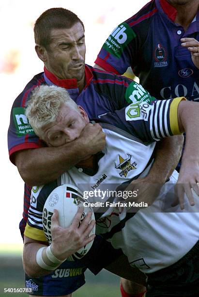 The Knights' Andrew Johns tackles the Cowboys' Mitchell Sargent during the NRL rugby league match between the Newcastle Knights and North Queensland...