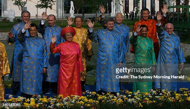 Leaders of the APEC countries pose for a photograph wearing traditional Vietnamese silk gowns, including Australian Prime Minister John Howard, at...