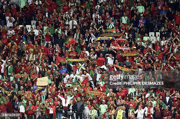 Portugal supporters cheer prior to the Euro 2016 group F football match between Portugal and Iceland at the Geoffroy-Guichard stadium in...