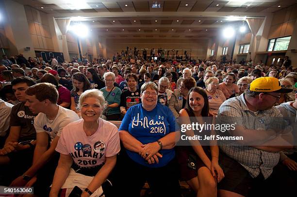 Attendees listen as presumptive Democratic nominee for president Hillary Clinton speaks at the International Brotherhood of Electric Workers Hall on...