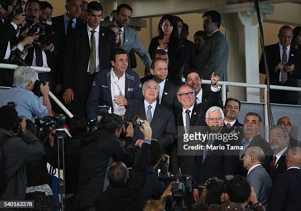Rio de Janeiro's Mayor Eduardo Paes stands with Brazil's interim President Michel Temer and president of the Brazilian Olympic Committee Carlos...