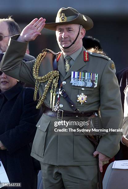 Admiral Chris Barrie hands over command of the Defence Forces to General Peter Cosgrove, pictured, who salutes him, at the change of command ceremony...