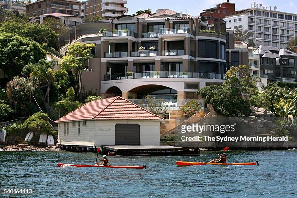 The Point Piper home of sydney businessman John Symond and the wharf near his home belonging to the Scots college where he wants to moore his new...