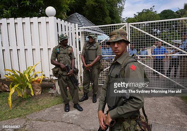 Fiji Unrest. Soldiers, including Meli Bainimarama, front, the son of Fiji's military chief Frank Bainimarama, surround the residence of the Fijian...