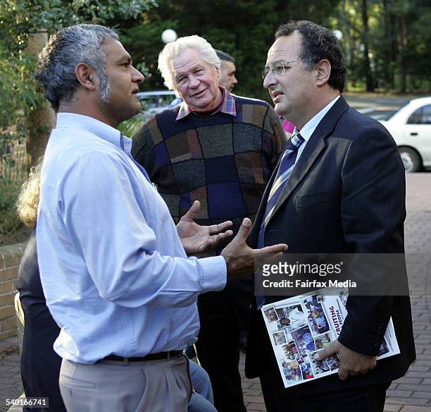 Illawarra ITeC's Richard Davis, left, speaks with NSW Aboriginal Affairs Minister Milton Orkopoulos as Colin Markham looks on, during a meeting with...