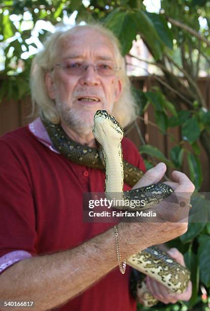Herpetologist Alyn Tilleard with a diamond python he captured in a backyard at Cherrybrook, released in bushland near the property, Sydney, 18...