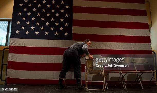 Worker packs up chairs after presumptive Democratic nominee for President Hillary Clinton spoke to supporters at the International Brotherhood of...