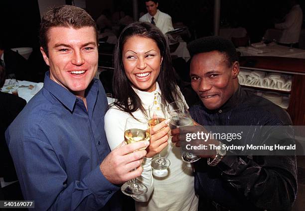 Gabrielle Richens with Australian cricketer Stuart MacGill, left, and boxer Lovemore Ndu, at lunch at the Rockpool on George, to launch her new...