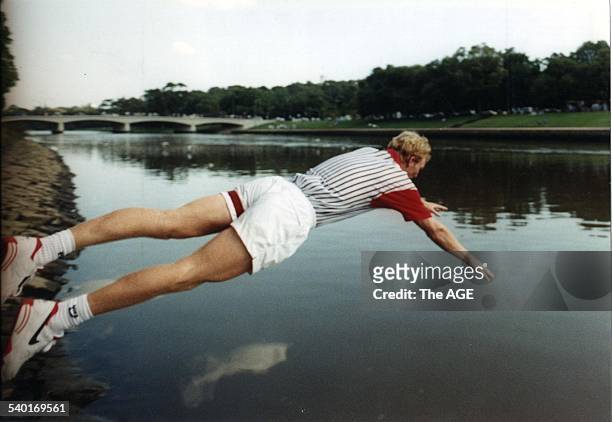 The Age of Tennis. Jim Courier dives into the Yarra to cool off after his second Australian Open title win in 1993. 1st February, 1993. THE AGE SPORT...