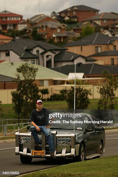 Cameron McKenzie with his 1997 VS Holden ute, in the Sydney suburb of Bella Vista, 9 November 2006. SMH Picture by STEVEN SIEWERT