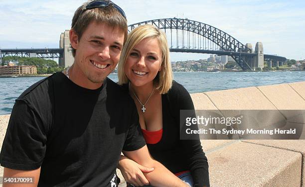 Australian golfer Aaron Baddeley and his wife Richelle pose in front of the Sydney Harbour Bridge, 12 November 2006. SMH Picture by TIM CLAYTON