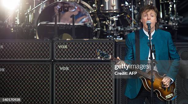 Ex-Beatle Paul McCartney performs on stage during his "One on one" tour at the Waldbuehne in Berlin on June 14 / AFP / dpa / Sophia Kembowski /...