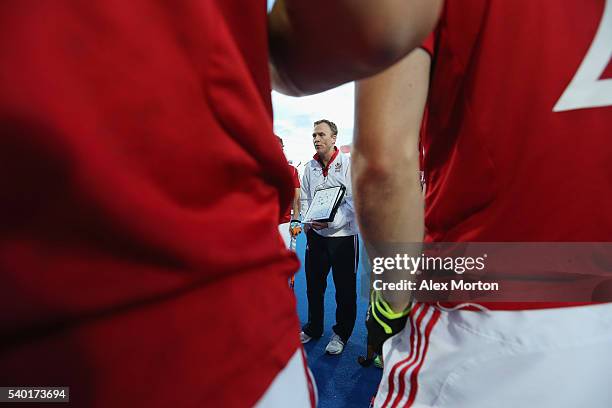 England coach Bobby Crutchley talks to his players at the first break during the FIH Mens Hero Hockey Champions Trophy match between Australia and...