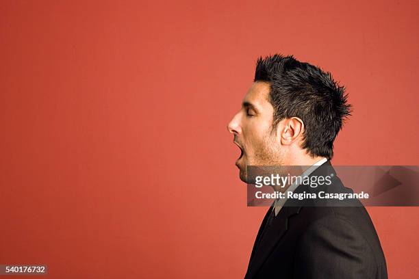 businessman yawning - mouth open profile stock pictures, royalty-free photos & images
