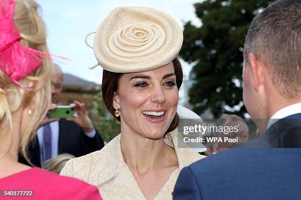 Catherine, the Duchess of Cambridge talks to guests as she attends the Secretary of State for Northern Ireland Theresa Villiers' Garden Party at the...