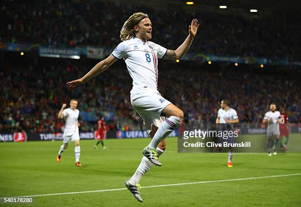 Birkir Bjarnason of Iceland celebrates scoring his team's first goal during the UEFA EURO 2016 Group F match between Portugal and Iceland at Stade...
