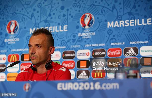 In this handout image provided by UEFA, Ansi Agolli faces the media during the Albania Press Conference at Stade Velodrome on June 14, 2016 in...