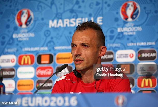 In this handout image provided by UEFA, Ansi Agolli faces the media during the Albania Press Conference at Stade Velodrome on June 14, 2016 in...