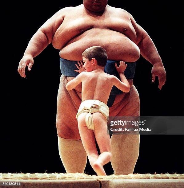 Sumo wrestler with a child