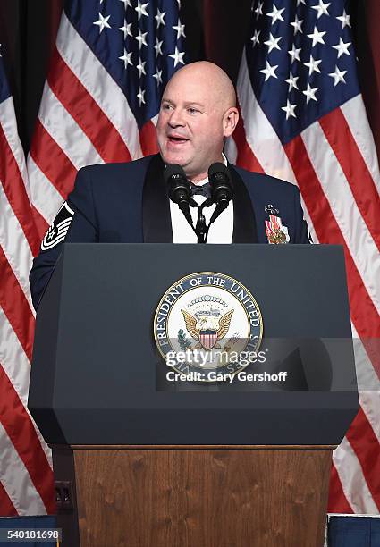 Event honoree Christopher A. Irving speaks on stage during the 75th Annual Father Of The Year Awards Luncheon at The New York Marriott Marquis on...