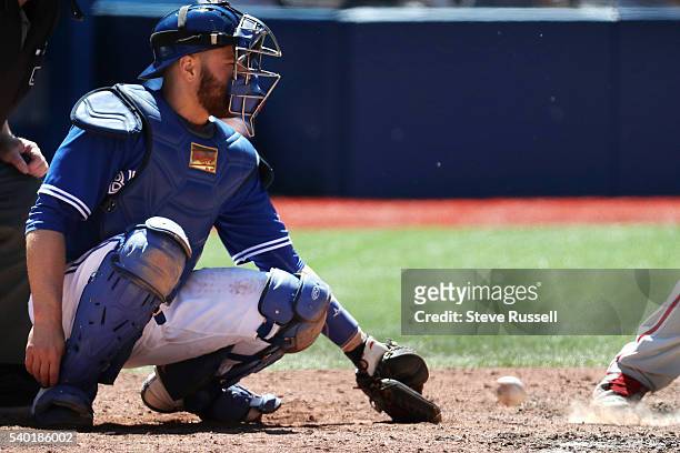 Russell Martin picks a ball out of the dirt as the Toronto Blue Jays play an afternoon game against the Philadelphia Phillies in Toronto. June 14,...