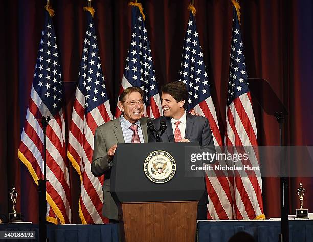 Event honoree Joe Namath and President of Save the Children Action Network, Mark Shriver pose for a picture on stage during the 75th Annual Father Of...