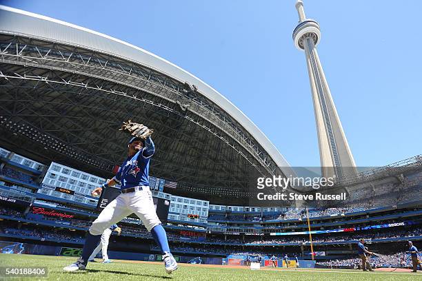 Devon Travis warms up as the Toronto Blue Jays win an afternoon game against the Philadelphia Phillies in Toronto. June 14, 2016.