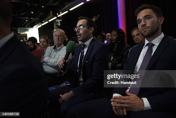 In this handout photo issued by the Daily Telegraph, People ask questions during a Huffington Post/Daily Telegraph EU debate on June 14, 2016 in...