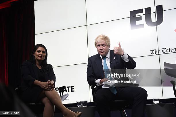In this handout photo issued by the Daily Telegraph, Priti Patel and Boris Johnson take part in a Huffington Post/Daily Telegraph EU debate on June...