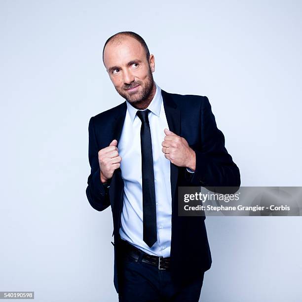 Sports journalist Christophe Dugarry poses during a photo shoot on September 27, 2016 in Boulogne Billancourt, Paris, France.