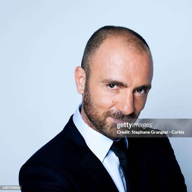 Sports journalist Christophe Dugarry poses during a photo shoot on September 27, 2016 in Boulogne Billancourt, Paris, France.
