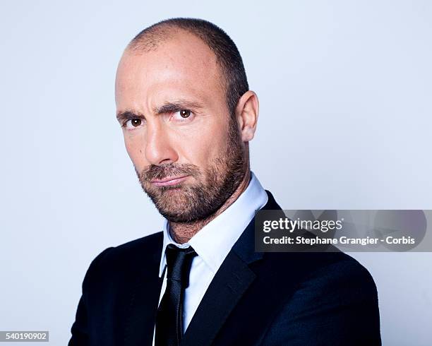 Sports journalist Christophe Dugarry poses during a photo shoot on September 27, 2016 in Boulogne Billancourt, Paris, France.