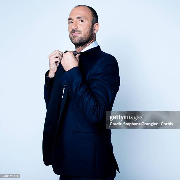 Sports journalist Christophe Dugarry poses during a photo shoot on September 27, 2016 in Boulogne Billancourt, Paris, France.